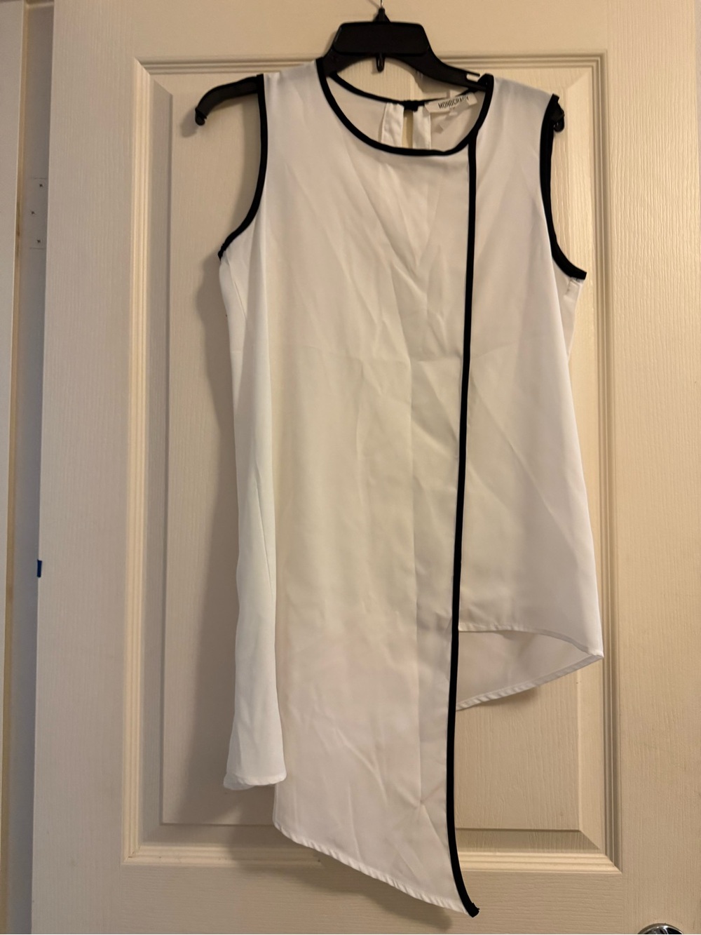 Asymmetrical White Sleeveless Top with Black Trim
